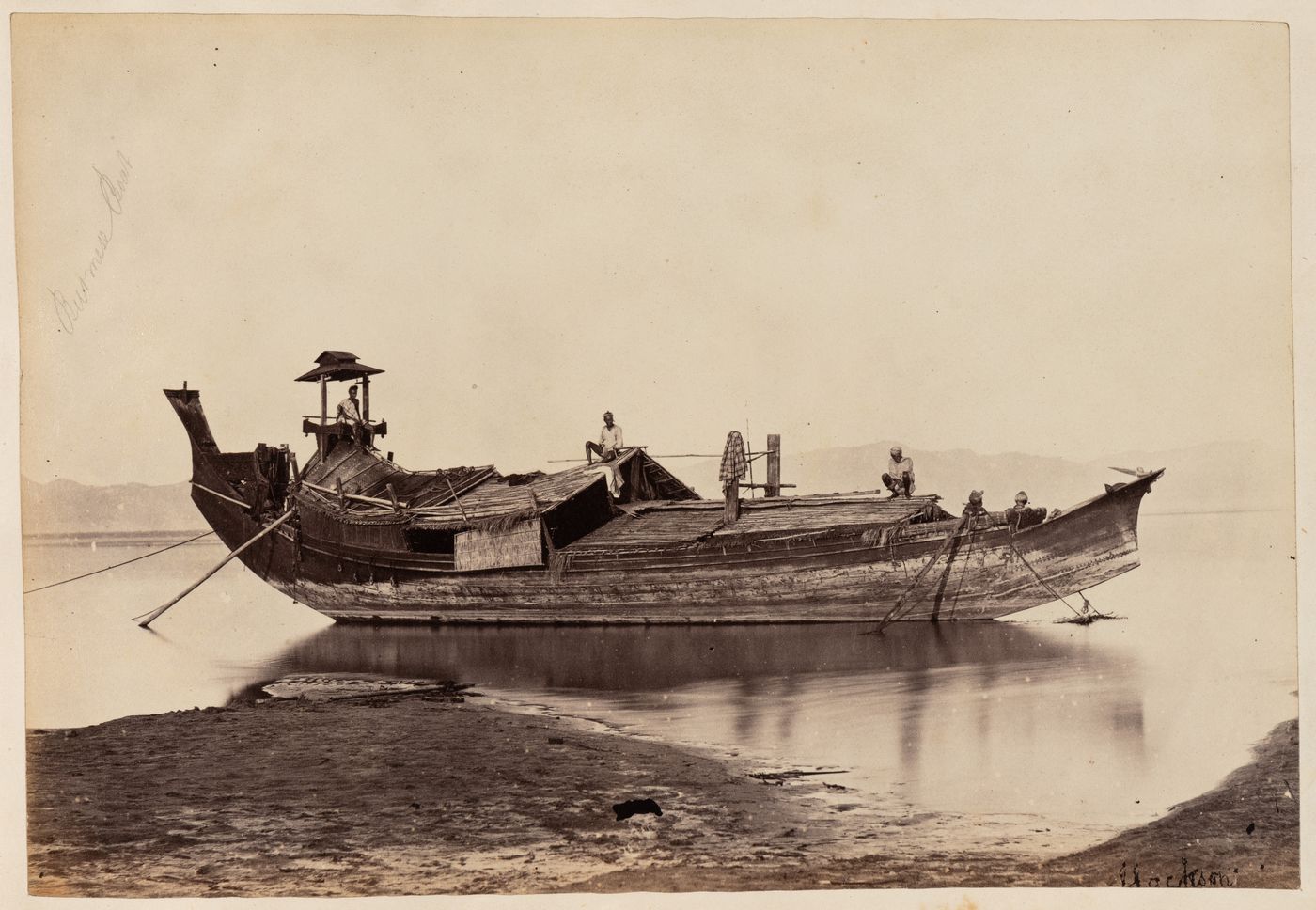 View of a boat on the Irrawaddy River, Burma (now Myanmar)