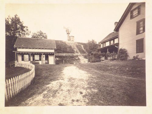 Wood houses with windmill on hill