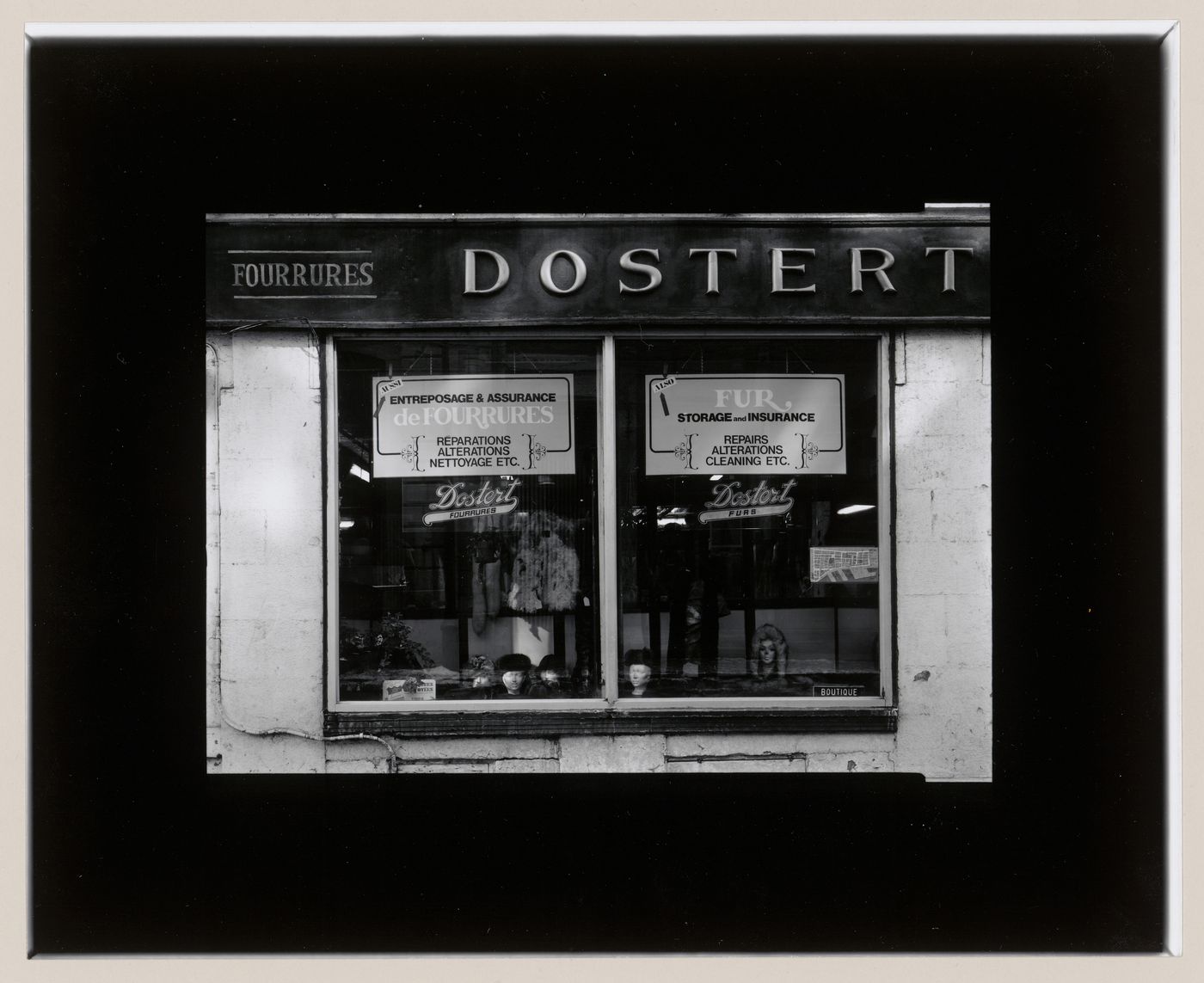 View of display windows of the Dostert Fourrures store, 372 rue Saint-Paul Ouest, Montréal, Québec