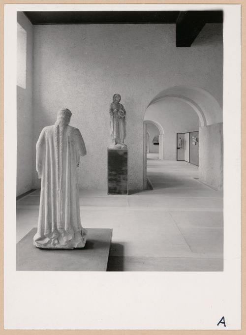 Interior view of a gallery showing statues with doorways and other galleries in the right background, Museo di Castelvecchio, Verona, Italy