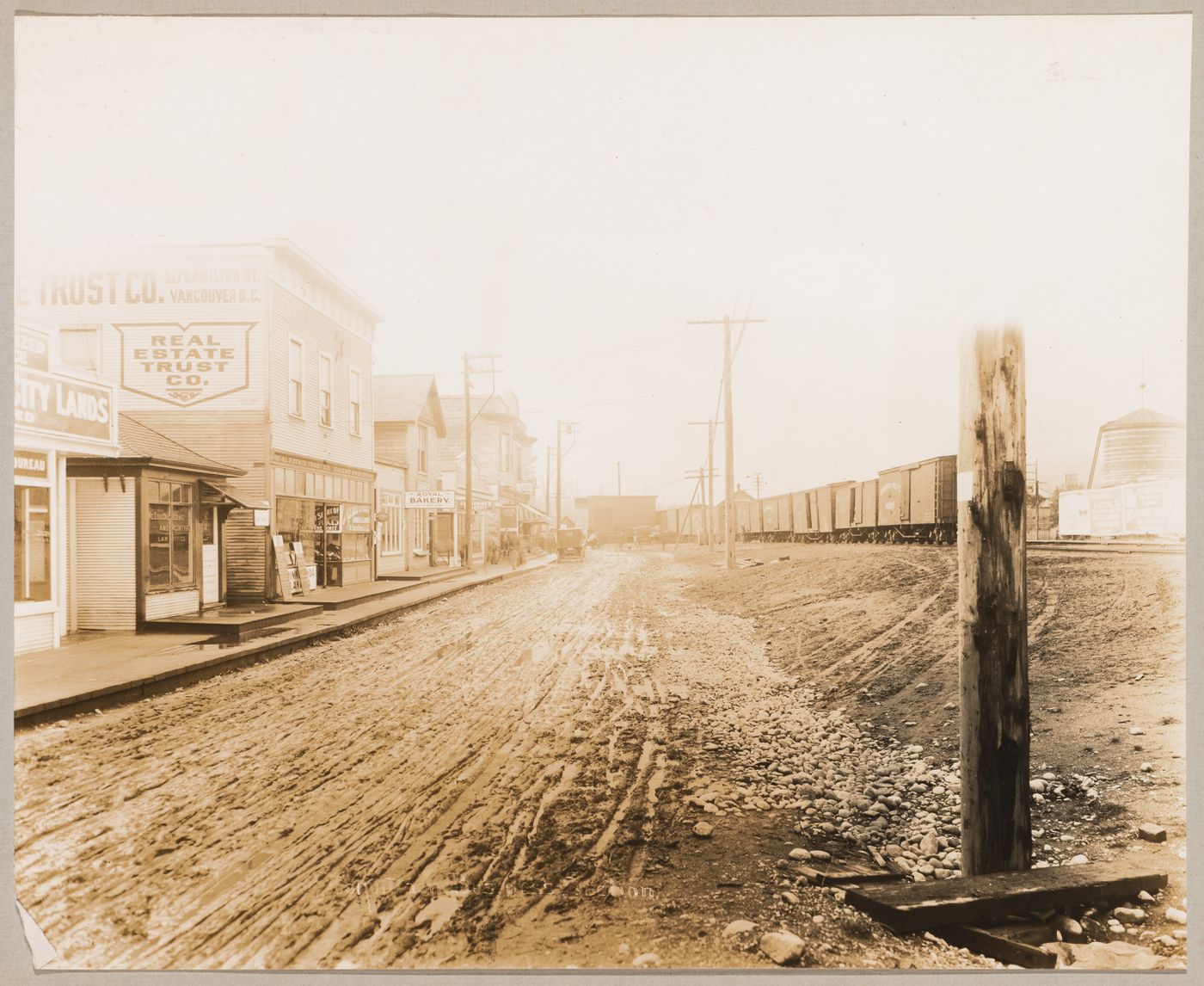 View of the Old Business Centre with a train on the right, Coquitlam (now Port Coquitlam), British Columbia