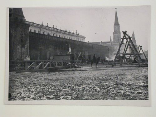 View of the construction site of the first wooden Lenin Mausoleum with the Nikol'skaya Tower (Nicholas Tower) in the background, Red Square, Moscow