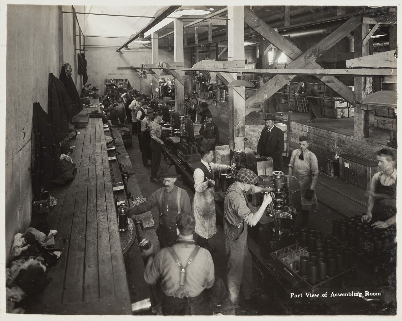 Interior view of workers in the assembling room at the Energite Explosives Plant No. 3, the Shell Loading Plant, Renfrew, Ontario, Canada