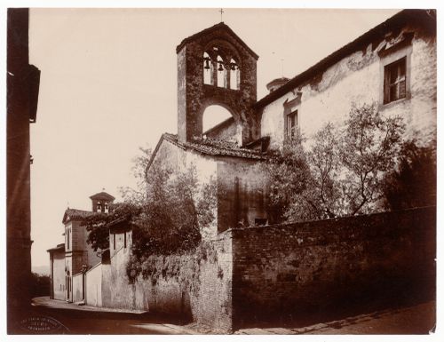 Partial view of a church showing a bell tower, Siena, Italy