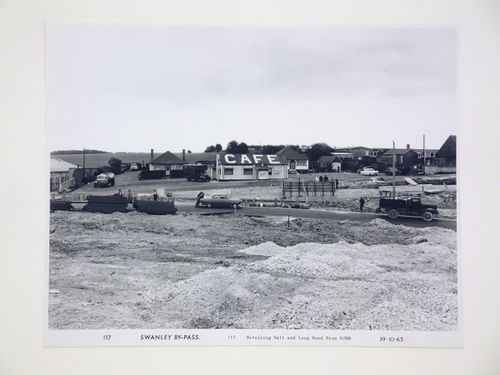 View of retaining wall and Loop Road from eastern junction road bridge, during construction of the Swanley Bypass, England