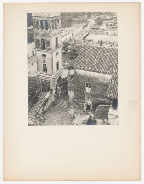 Partial view of a tower and house with an arena [?] and houses in the background, from the Catedral de Cuernavaca, Cuernavaca, Mexico