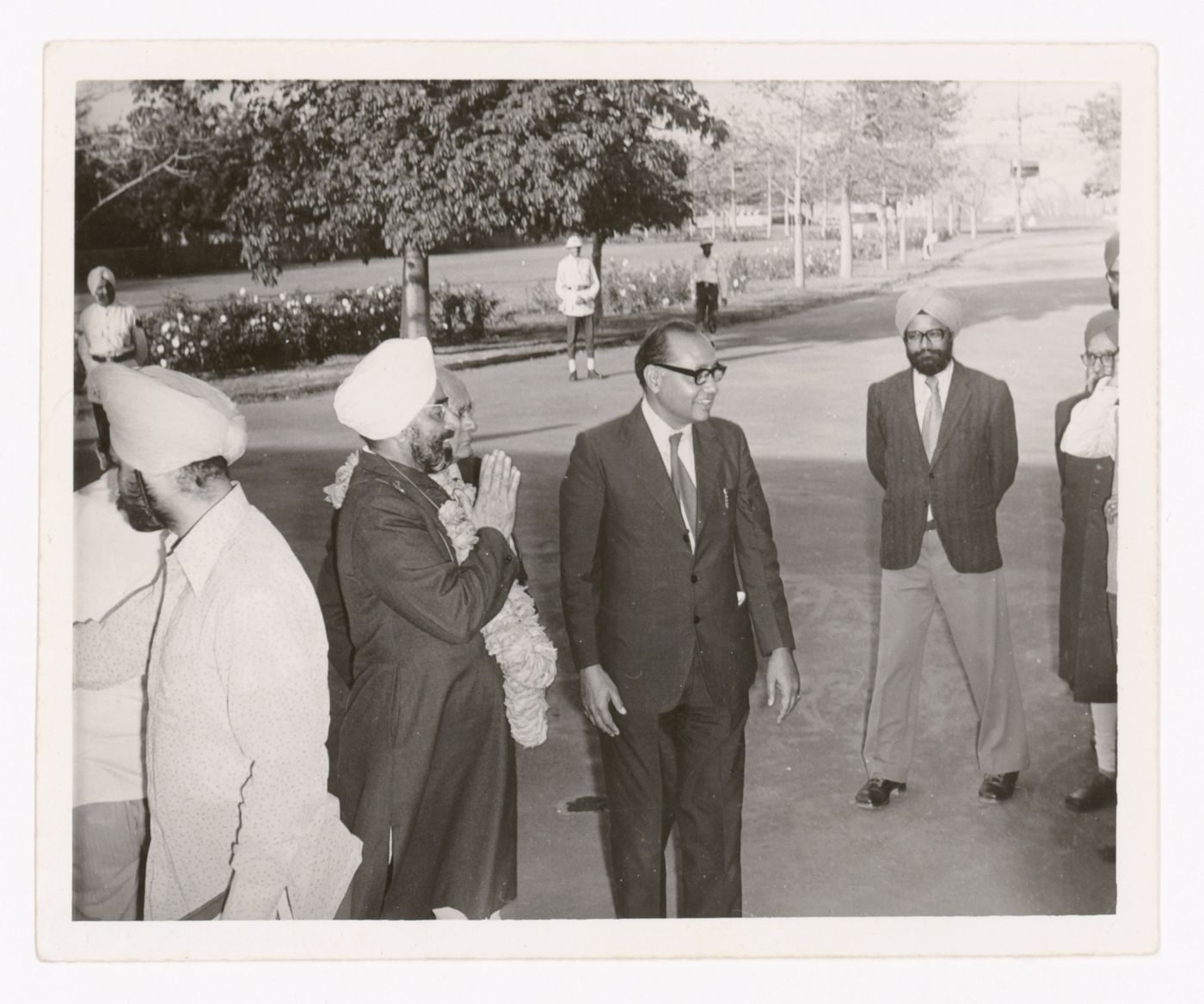 Photograph of Aditya Prakash and a group of unidentified men