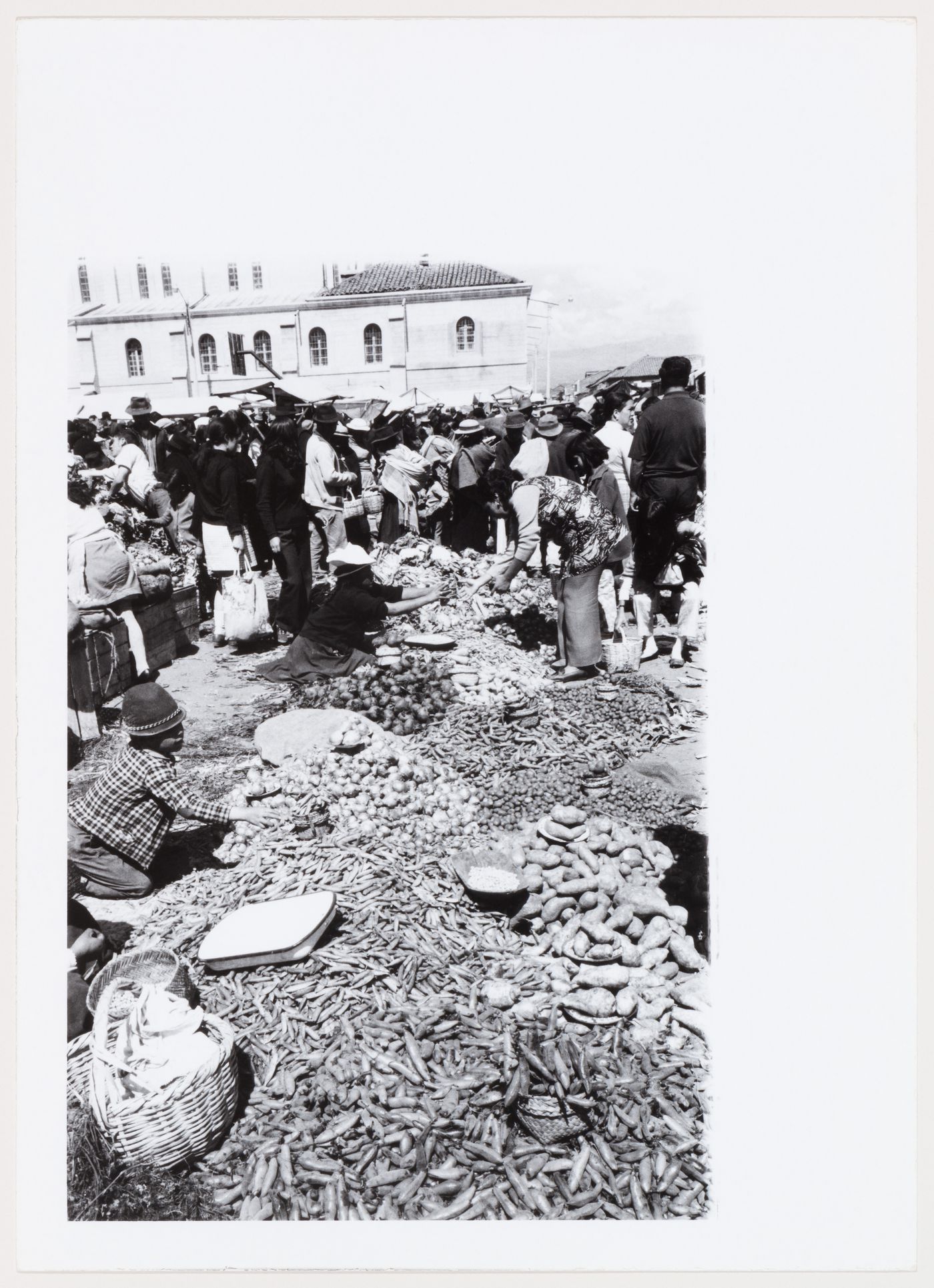 People and food in a market, South America