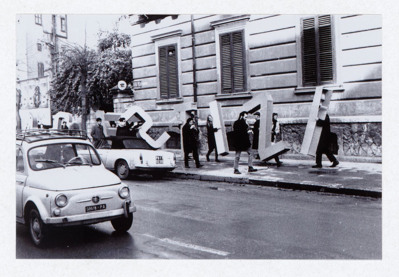 Photograph of the installation been carried to the sea for Grazia & Giustizia