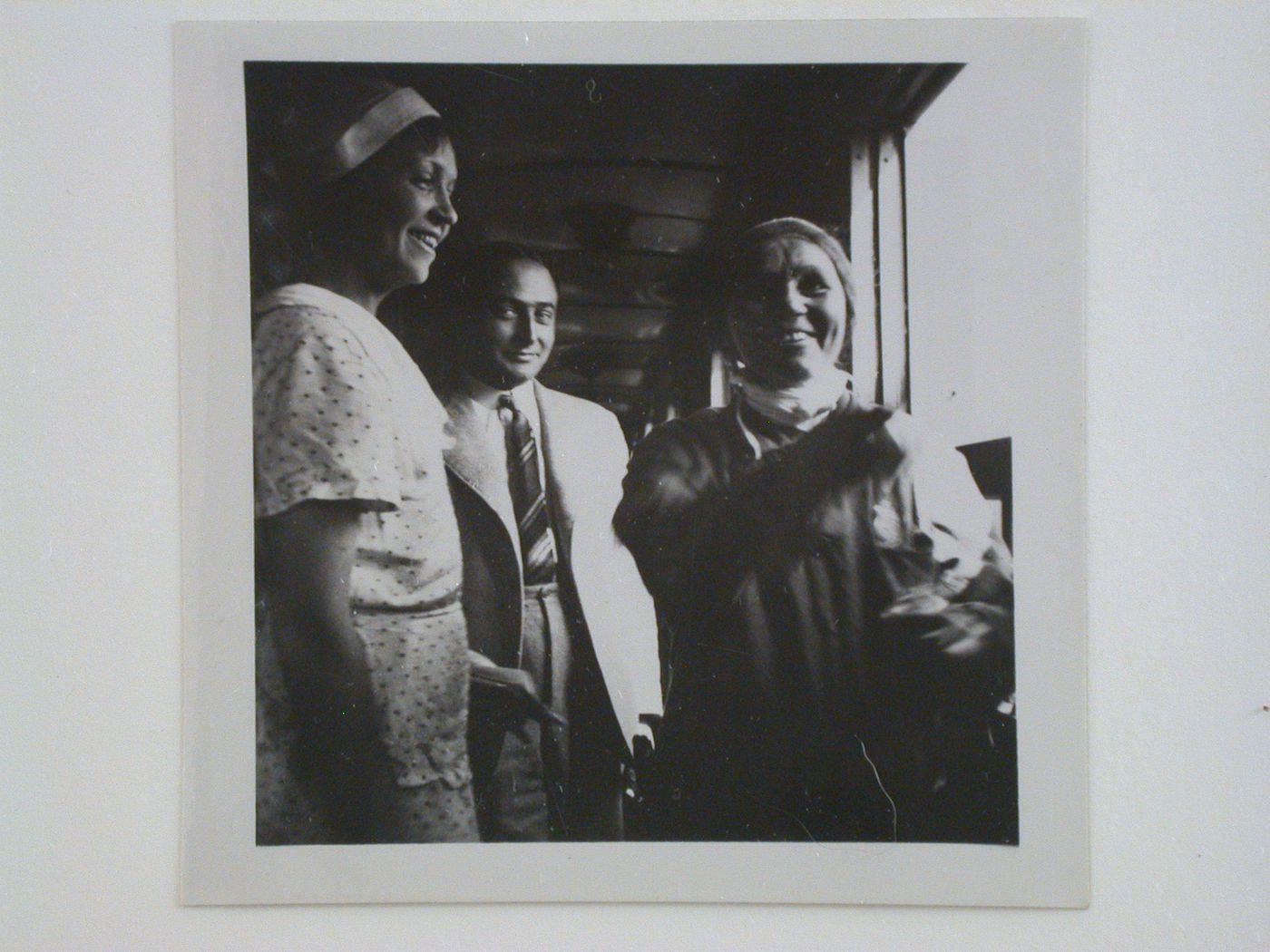 Group portrait of study tour members in a train car (Mme Boyer at left)