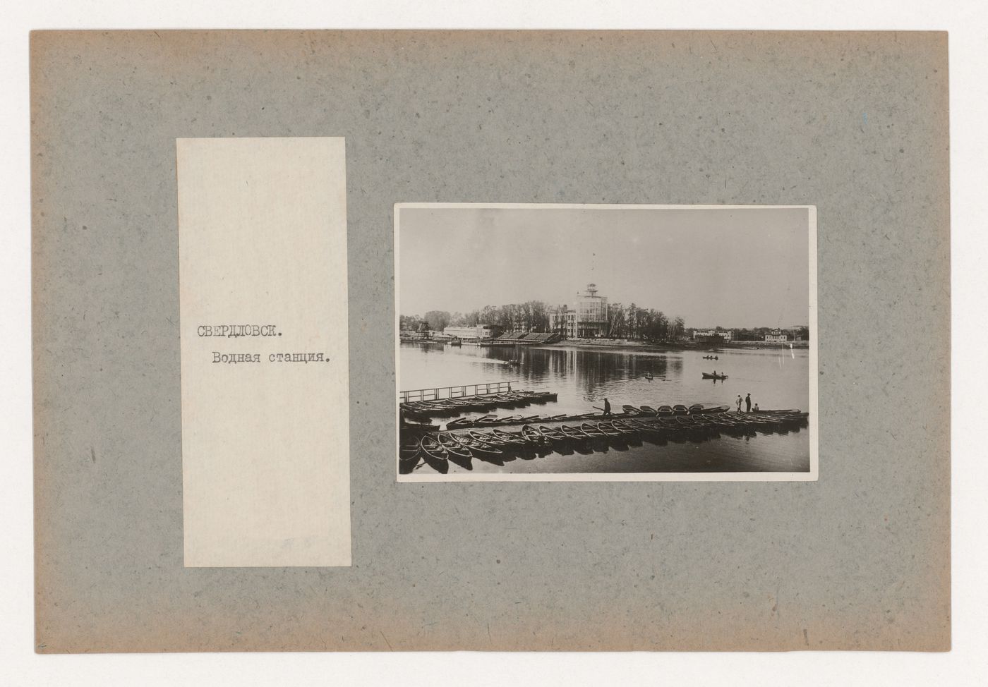 View of the Dinamo water sports station from across the pond showing boats at the pier, Sverdlovsk, Soviet Union (now Ekaterinburg, Russia)