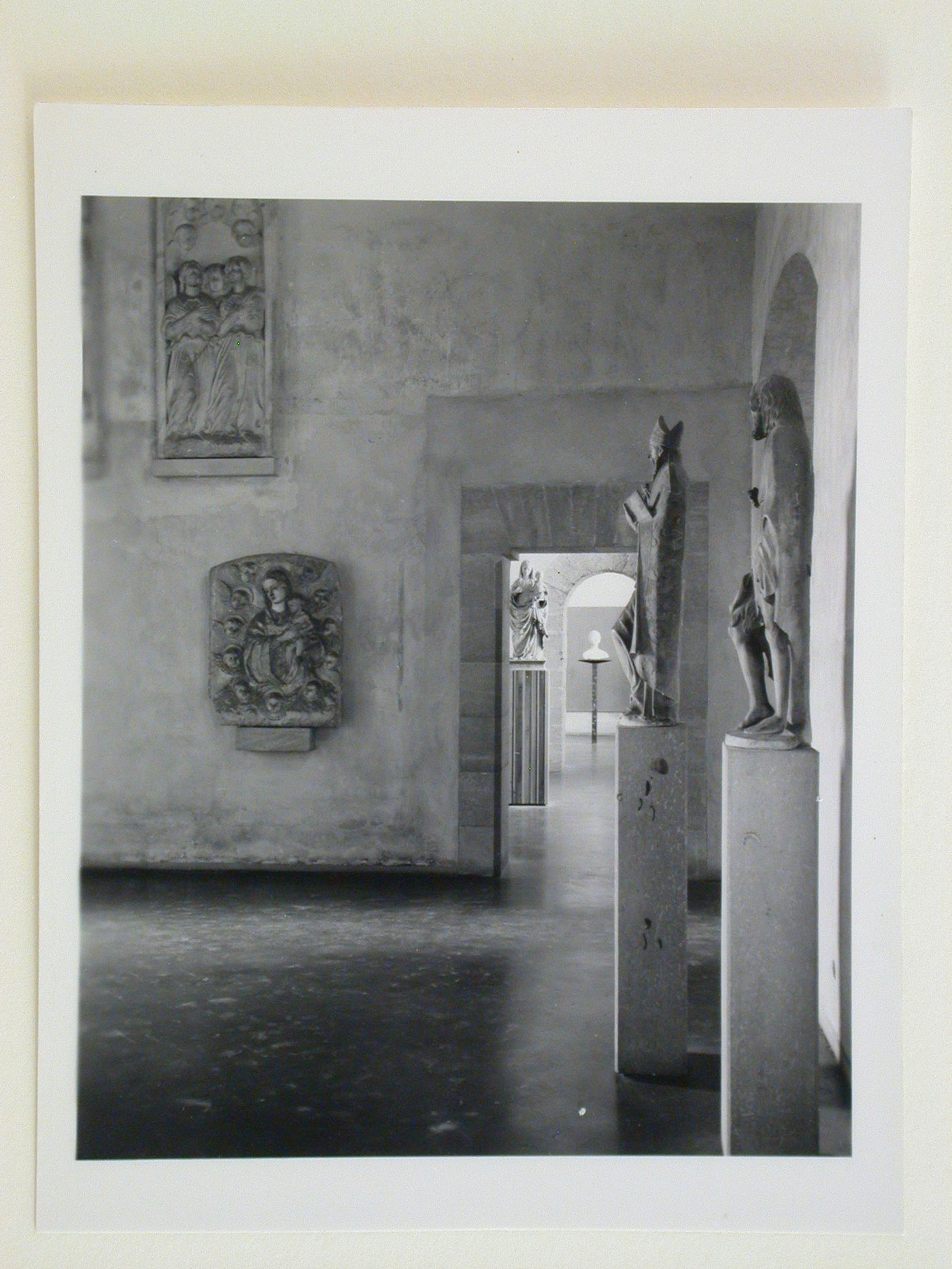 Interior view of the Sala della scultura, a doorway and the Sala dei Gagini showing statues, Palazzo Abatellis, Galleria regionale della Sicilia, Palermo, Italy