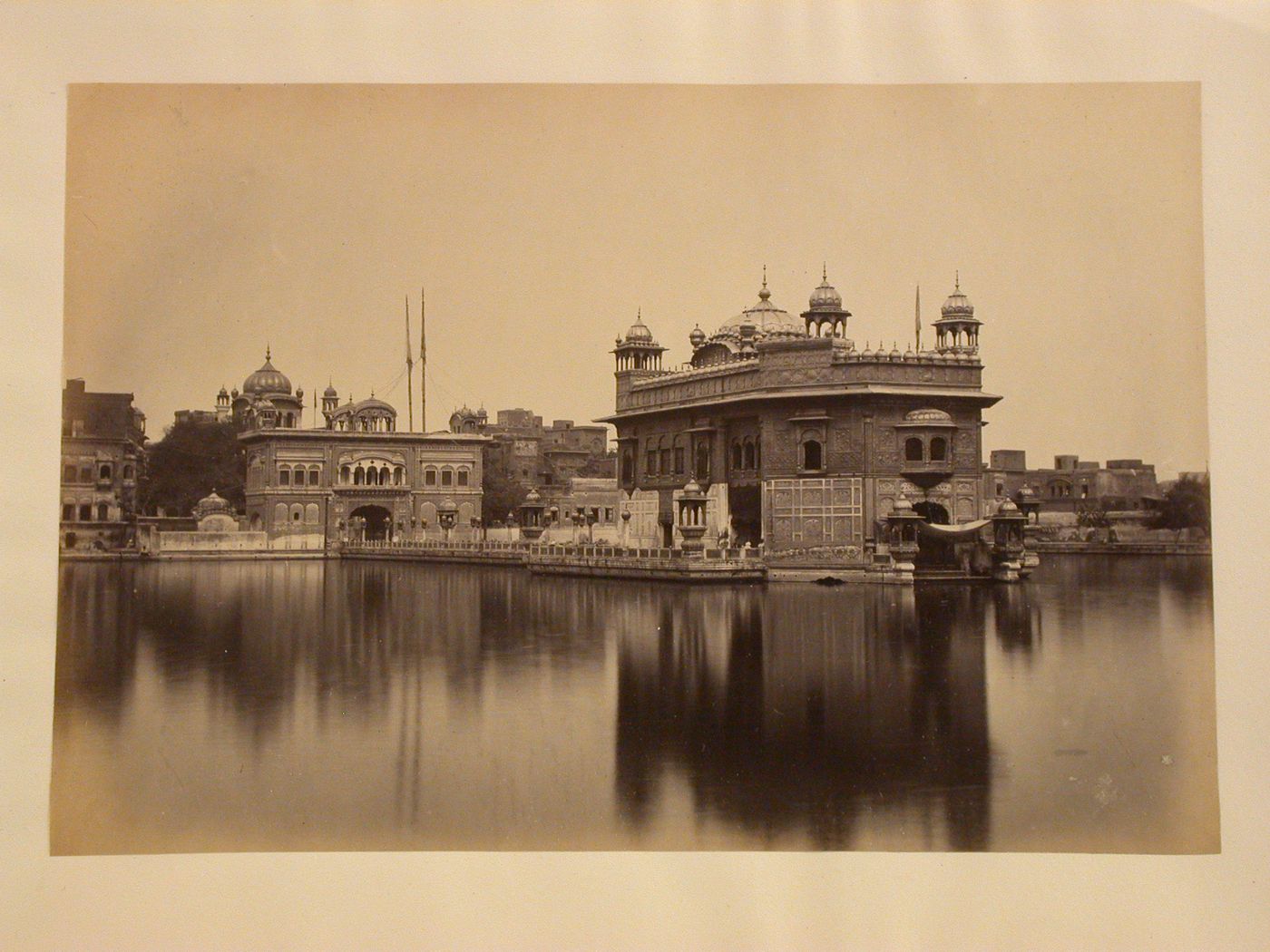 View of the Golden Temple (also known as Darbar Sahib), with the water tank in the foreground, Amritsar, India