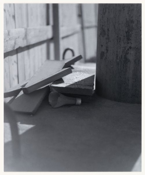 View of wood scraps, a broken bottle or light bulb, a wooden post and a wooden fence, Berlin, Germany, from the artist book "The Potsdamer Project"