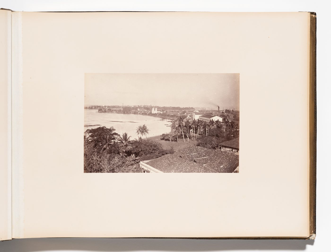 Panoramic view of Colombo showing Beira Lake and St. Philip's Church with the clock tower and lighthouse in the left background and the harbour in the right background, Colombo, Ceylon (now Sri Lanka)