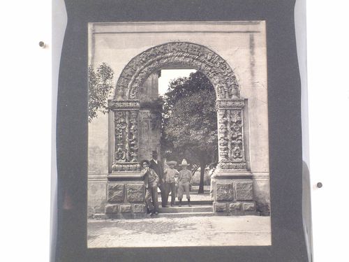 View of the gateway of the atrio of the Convento de San Juan Bautista showing people, Coyoacán, Mexico