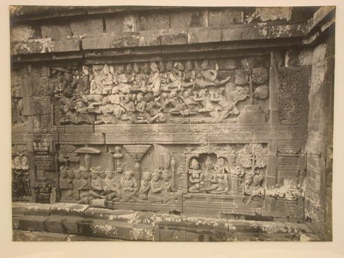 Close-up view of relief panels on the temple of Borobudur depicting trees and figures, Borobudur, Indonesia