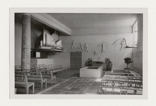 Interior view of the Chapel of Faith showing pews, organ pipes and the wall relief designed by Ivar Viktor Johnsson, Woodland Crematorium and Cemetery, Stockholm