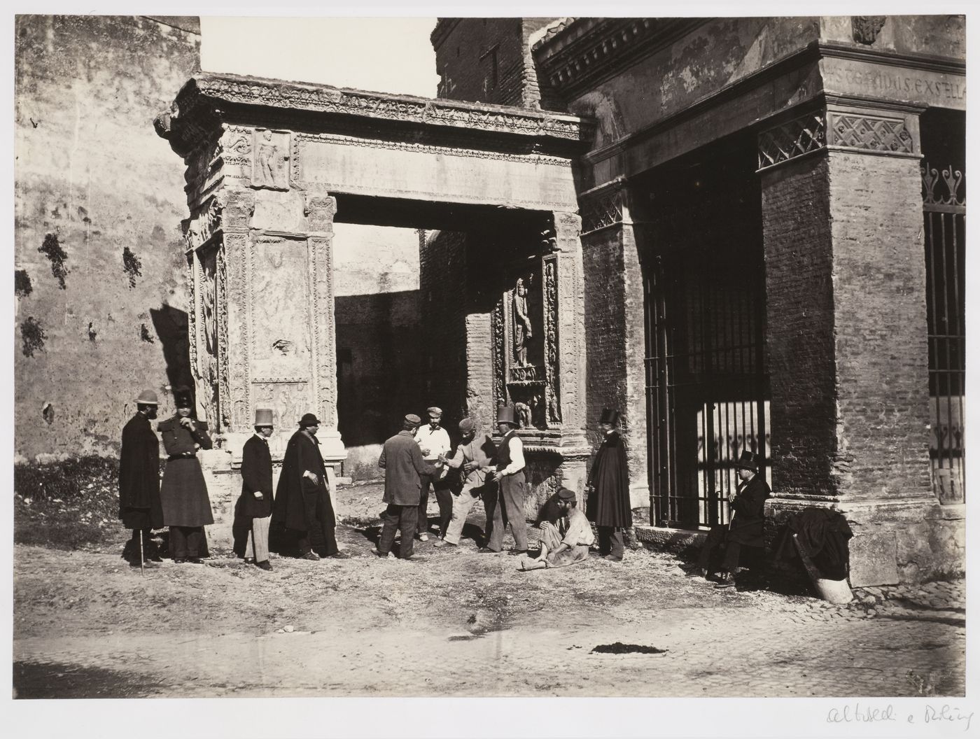 Arch of the Silversmiths, view with men gambling before arch, Rome, Italy