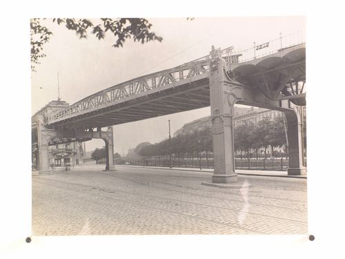 Worm's-eye view of the elevated railway system crossing a street