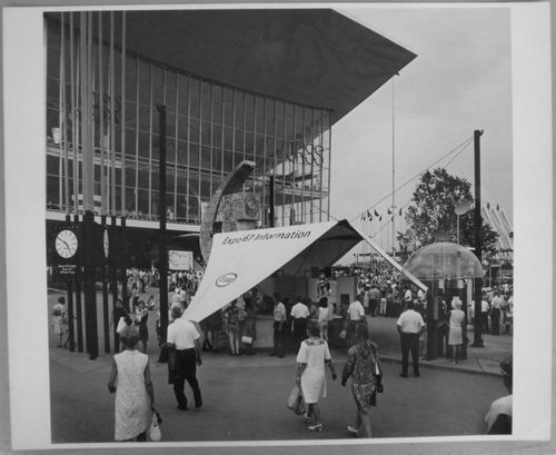 View of an information kiosk and a telephone booth in front of the Pavilion of the Soviet Union, Expo 67, Montréal, Québec