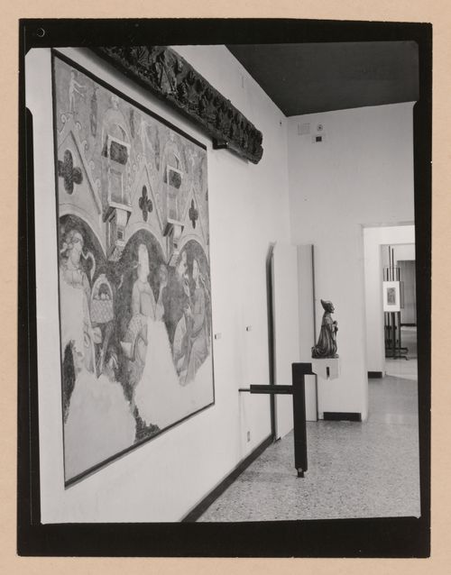 Interior view of a gallery showing a painting and a sculpture of a kneeling man, Museo Correr, Venice, Italy