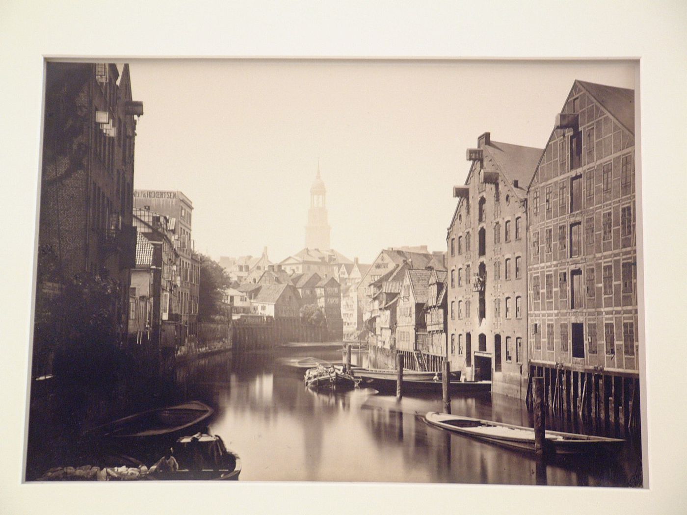 View of canal from bridge looking towards Saint Michaels Church in distance, Hamburg, Germany