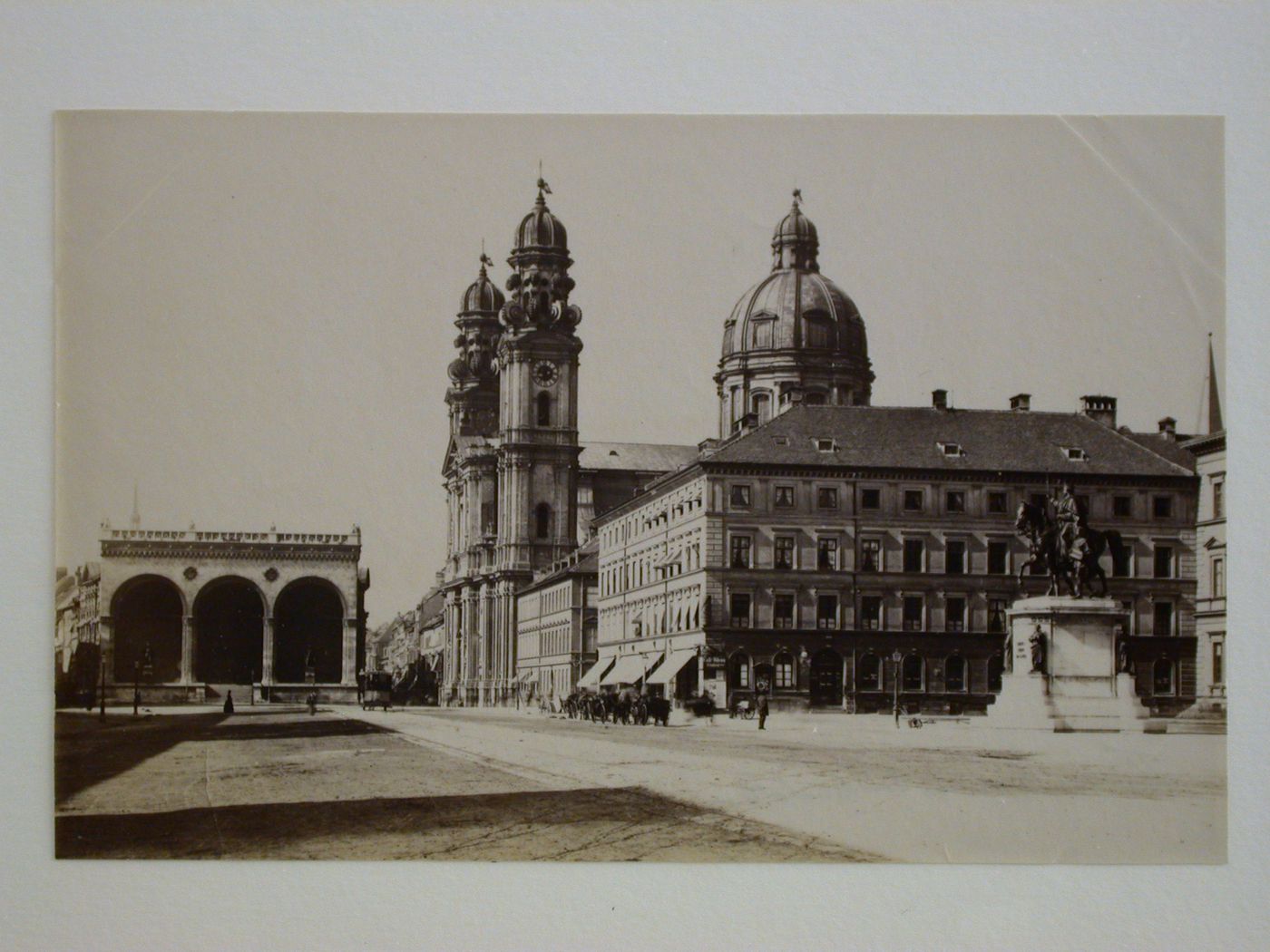 View of Odeonsplatz with the principal façade of Feldherrenhalle loggia on the left, the Theatinerkirche of Saint Kajetan [Theatine Church of Saint Cajetan] on the right, and an equestrian statue in the foreground, Theatinerstrasse 22, Munich, Germany