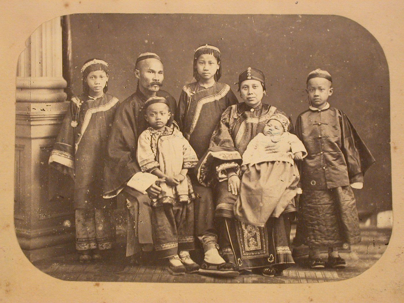Family portrait of Chan Laisun and family, China