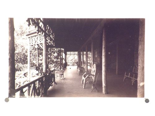 View of large rough-hewn wooden porch, Lake George, New York
