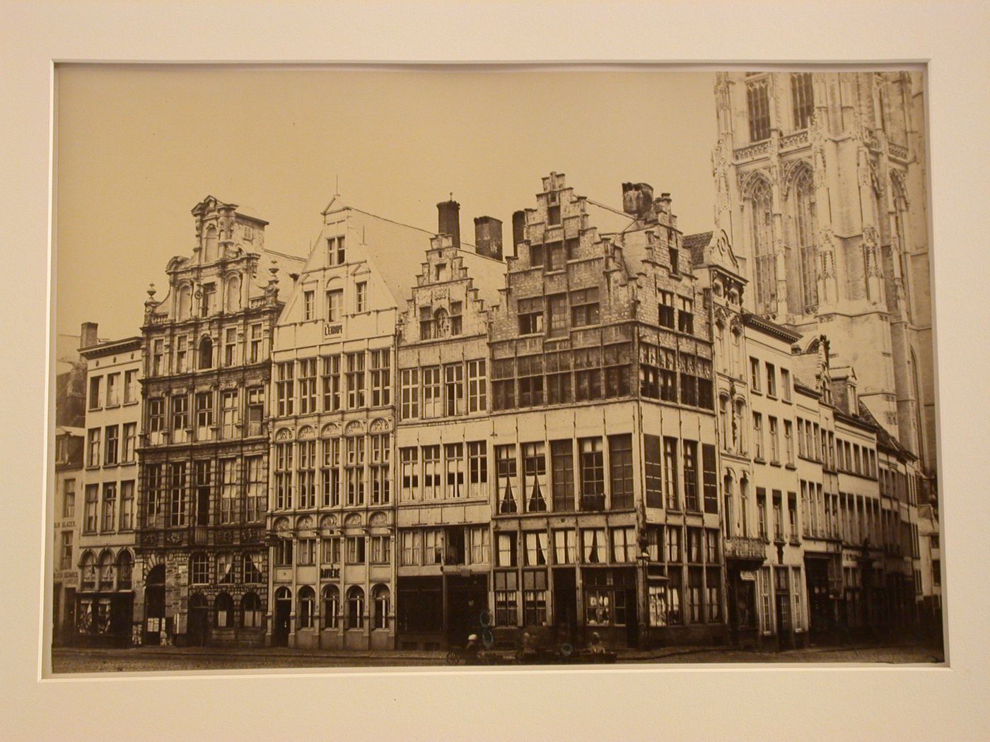 Exterior view, façades of guild houses on a square, and intersecting street, with part of church tower in background, Antwerp, Belgium