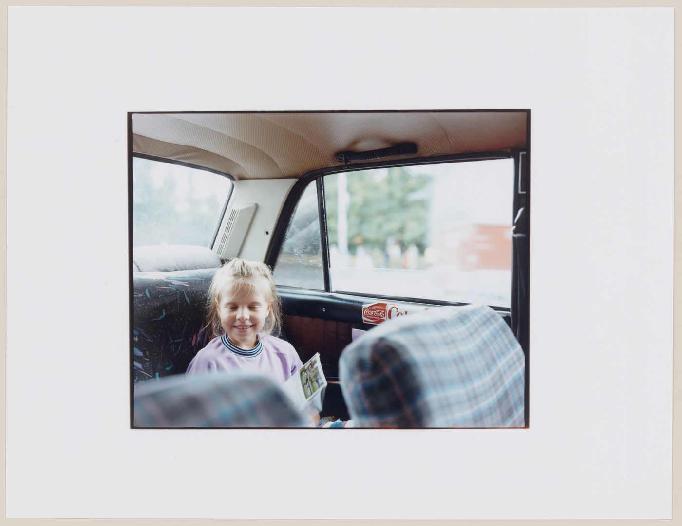 Portrait of a girl in the backseat of an automobile, Kaliningrad, Kaliningradskaia oblast', Russia (from the series "In between cities")