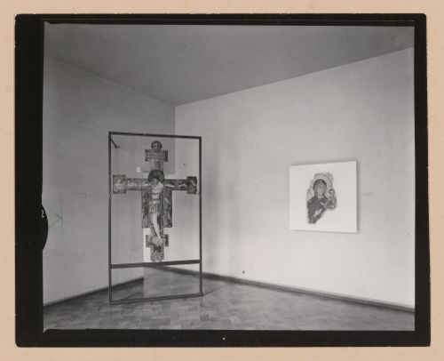 Interior view of the Sala della croce giunteesca showing a painted crucifix mounted on a metal easel and a painting, Palazzo Abatellis, Galleria regionale della Sicilia, Palermo, Italy