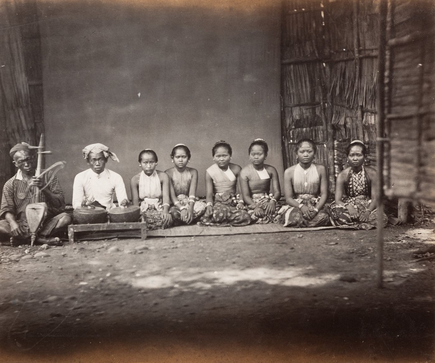 Group portrait of men and women, probably musicians, Java, Indonesia