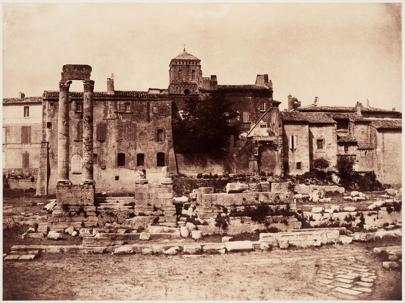 View of ruined Roman theater with town behind, Arles, France