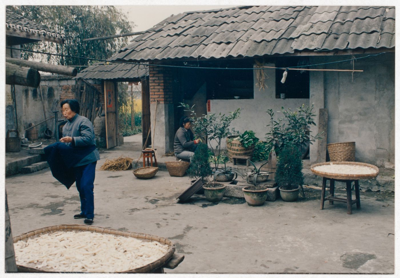 View of rural house interior court with its residents in Sichuan province, China