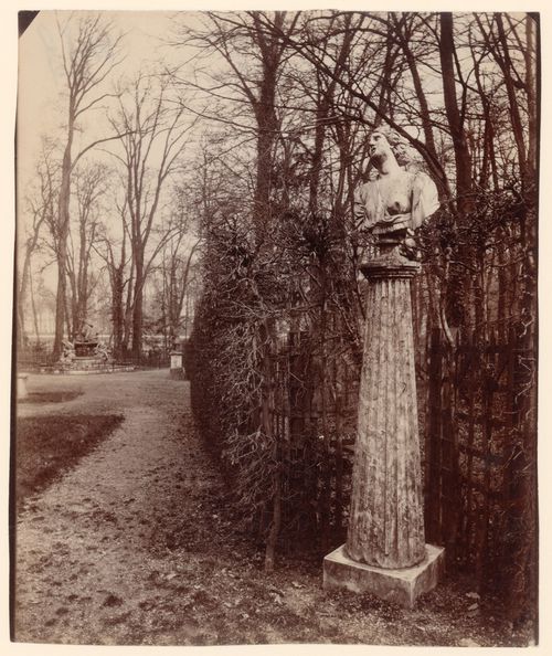 View of the arbor of the Triumphal Arch, statue on column pedestal in foreground, Versailles, France