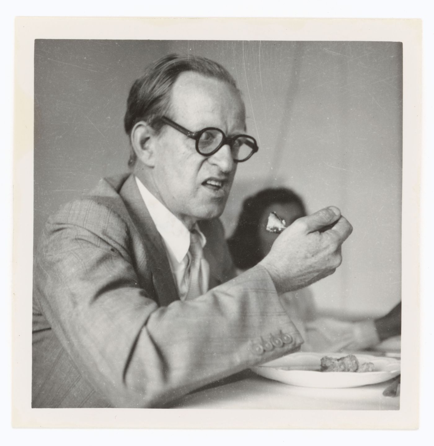 Portrait of Maxwell Fry eating, possibly in Chandigarh, India
