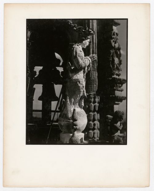View of a statue with a bell tower in the background, Santa Prisca, Taxco de Alarcón, Mexico