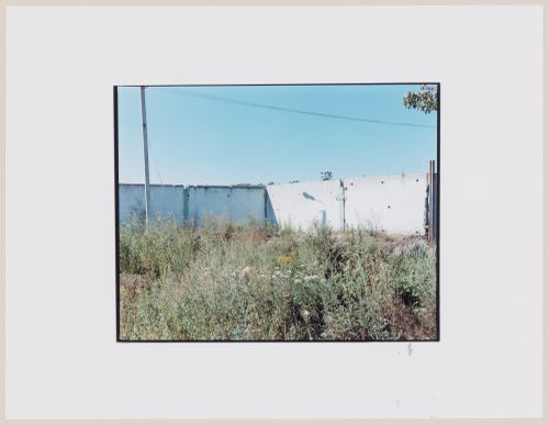 View of concrete walls and a vacant lot, Ushakovo, near Ladushkin, Kaliningradskaia oblast', Russia (from the series "In between cities")