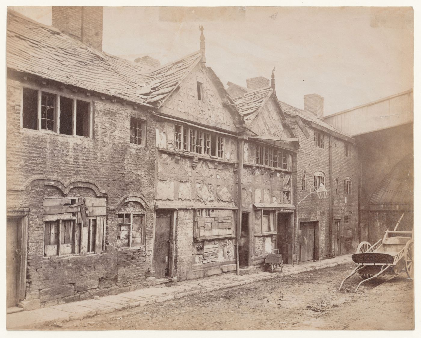 View of dilapidated houses on narrow street, Manchester, England