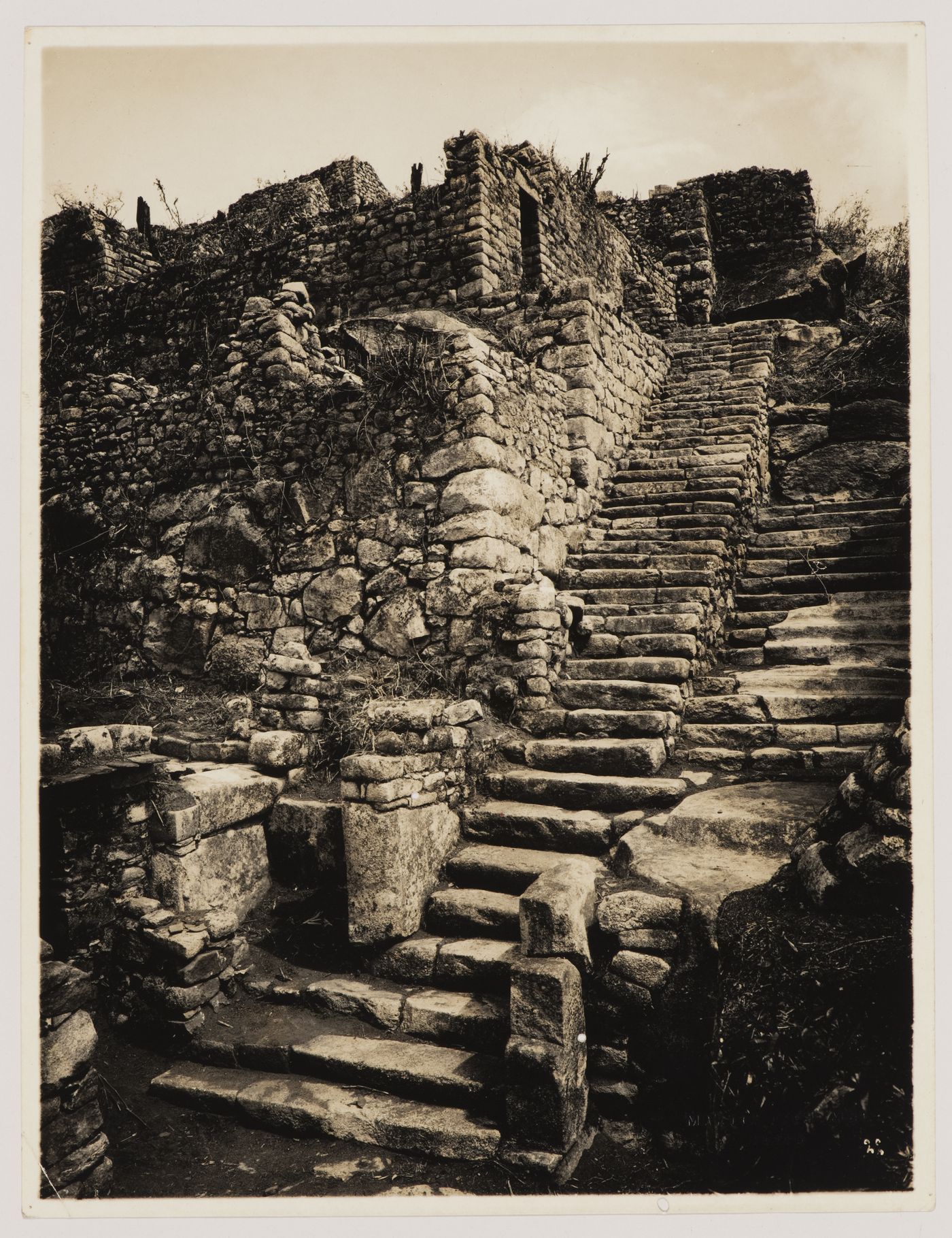 View of the upper portion of the Staircase of the Fountains with unidentified buildings on the left, Machu Picchu, Peru