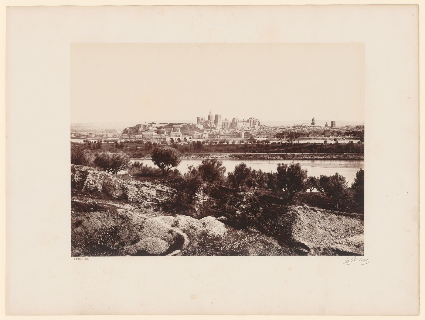 General view from the north of Avignon showing landscape and the Rhône in the foreground, and the Palais des Papes and the Pont d'Avignon in the distance, France