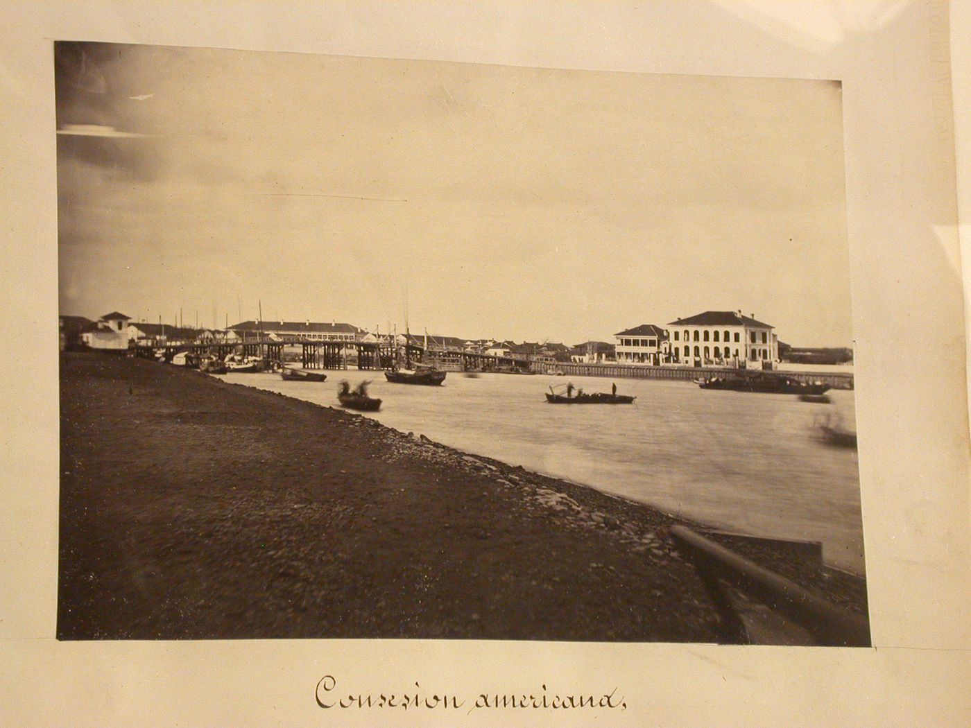 View of a briddge across Soochow Creek [?] and the American concession in the background, Shanghai, China