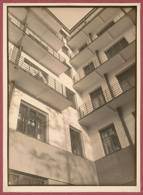 Partial exterior view of the Dukstroi Apartment Building from the courtyard showing balconies and windows from below, 34 Leningradskoe Shosse, Moscow