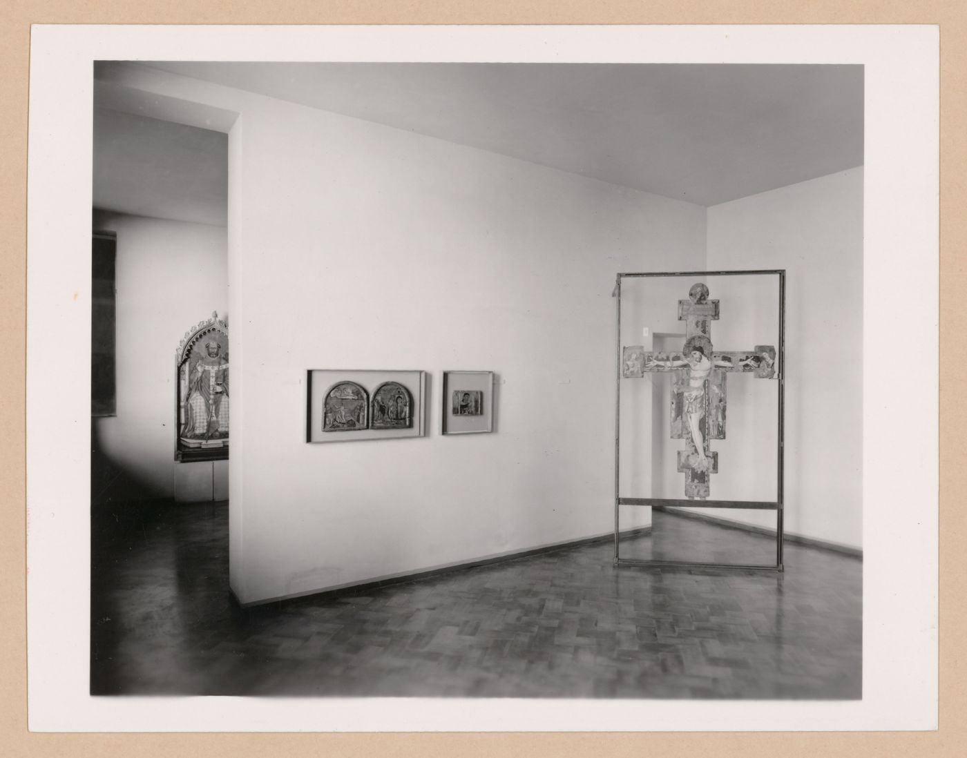 Interior view of the Sala della croce giunteesca showing a painted crucifix mounted on a metal easel and paintings, Palazzo Abatellis, Galleria regionale della Sicilia, Palermo, Italy