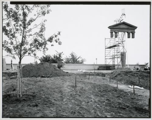 View of the Canadian Centre for Architecture Garden under construction showing the Tribune Allegorical Column surrounded by  scaffolds, Montréal, Québec, Canada