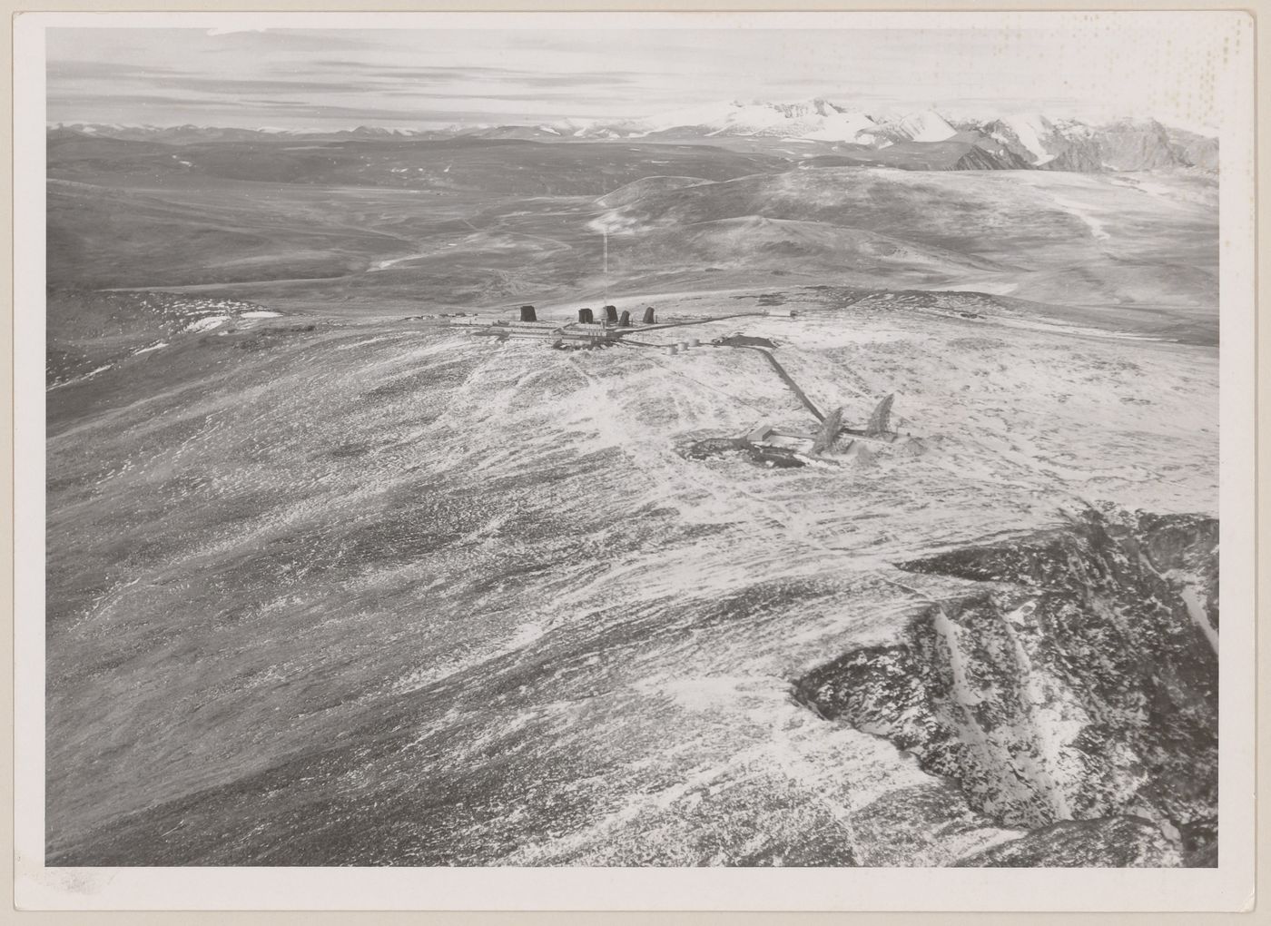 Aerial view of DEW Line radar station DYE-Main and DEW Drop troposcatter telecommunication system, Cape Dyer, Nunavut, Canada