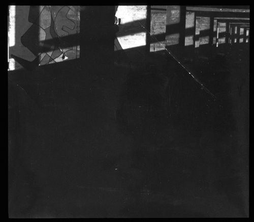 Interior view of a walkway with piers, possibly of Unité d'habitation, showing a mural designed by Le Corbusier, France