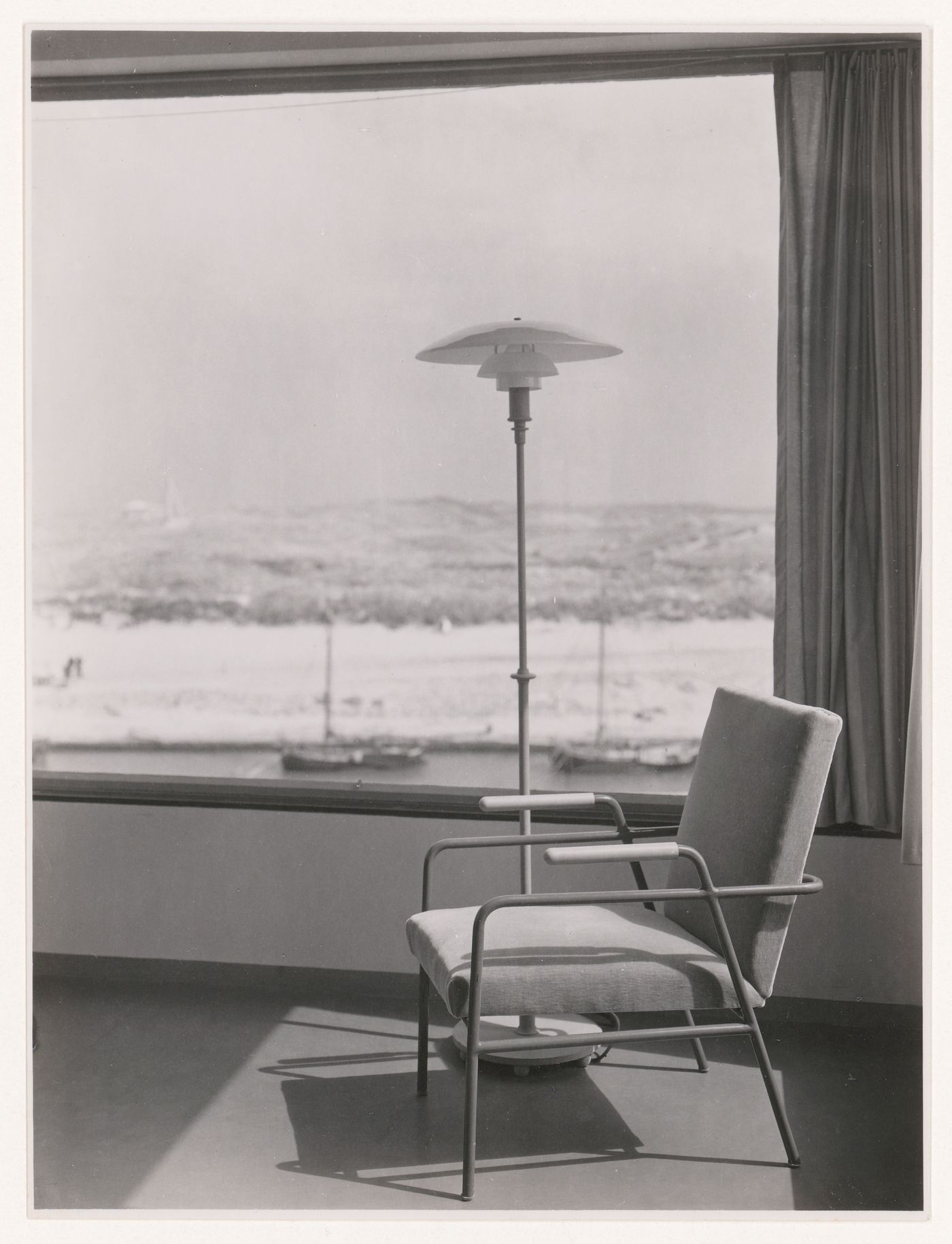 Interior view of the lounge of Villa Allegonda showing an armchair and lamp designed by J.J.P. Oud, Katwijk aan Zee, Netherlands